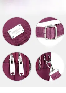 Detail view of purple oxford fabric texture with silver metal hardware and zippers