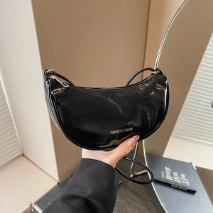 Retro black faux leather crescent shoulder bag with golden lettering for winter fashion
