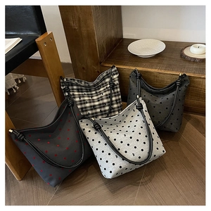Selection of four canvas tote bags with various polka dot and checkered patterns on wood floor