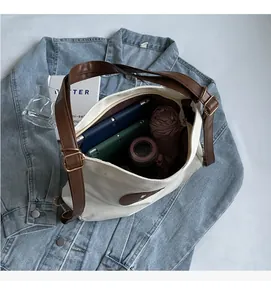 Top view of cream canvas tote bag interior showing capacity for tablet and daily items