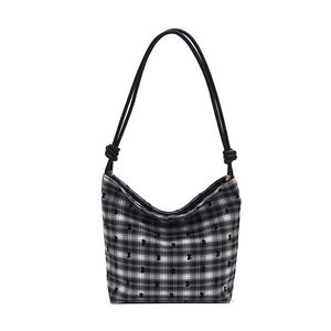 Chic black and white checkered canvas tote bag with bow details and knot shoulder strap