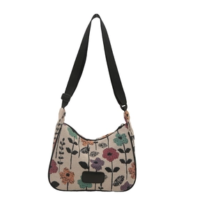 Minimalist large canvas shoulder bag with vibrant floral patterns and black strap