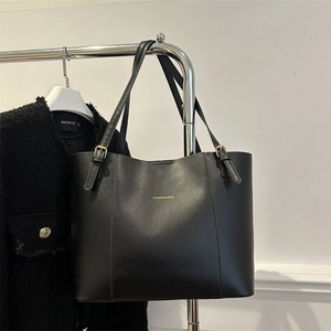 Minimalist large black tote bag with gold fashion lettering and adjustable handles