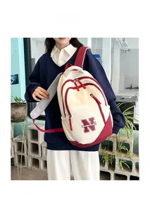 Detail view of canvas travel backpack featuring breathable honeycomb mesh shoulder straps