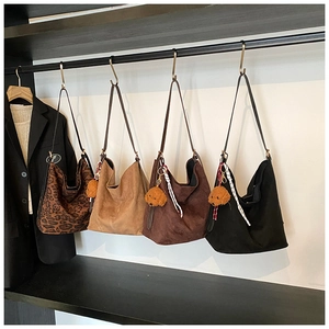 Four large capacity tote bags in leopard print, brown and black with bear charms