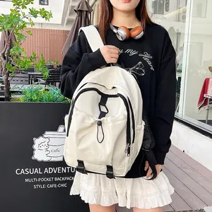 Minimalist white nylon backpack for students featuring black zippers and drawstring storage