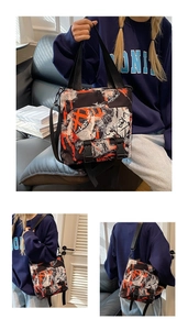 Detail of graffiti Oxford tote bag showing versatile carrying styles and buckles