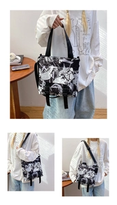 Detail view of graffiti pattern oxford tote with adjustable strap and buckle closure