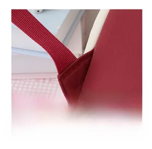 Close-up of reinforced triangular stitching on the shoulder strap of the school backpack