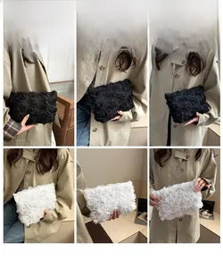 Detail view of 3D rose lace evening clutch bag in black and white styles with floral petals