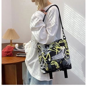 Large capacity oxford cloth messenger bag with yellow graffiti art and buckle straps
