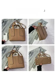 Brown lychee leather bucket bag with gold hardware and bottom protective feet