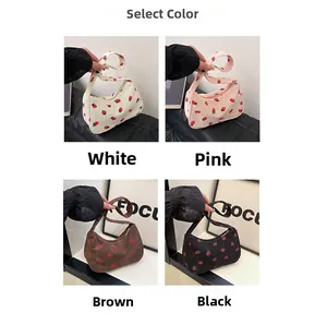 Selection of corduroy hobo bags with strawberry embroidery in four different colors