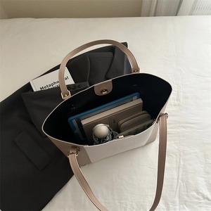 Top view of large white tote bag showing spacious interior with tablet and daily essentials