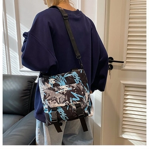 Detail of adjustable strap and buckle closure on the graffiti messenger bag
