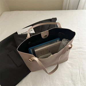Top view of beige tote bag showing spacious interior with tablet, notebook and umbrella