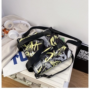 Detail of trendy nylon crossbody bag with street style graffiti and functional buckles