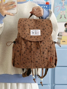 Brown corduroy backpack with bow print and cute patch for travel and school use