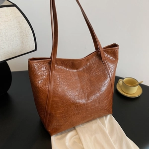 Brown crocodile embossed tote bag with large capacity and minimalist commuter style