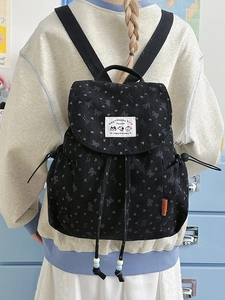 Black corduroy backpack with bow prints and drawstring closure for women