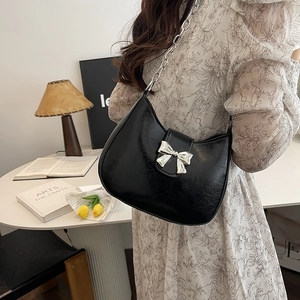 Chic black crescent hobo bag with silver bow buckle and chain strap for women
