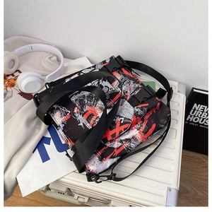 Detail of street graffiti oxford messenger bag with dual buckle closures and compartments