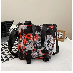 Detail view of graffiti style oxford tote bag with secure buckle straps and dual handles