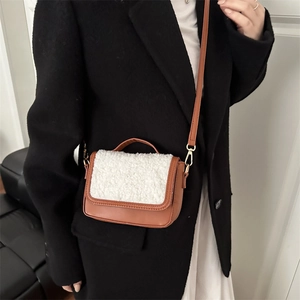 Minimalist brown faux leather and white shearling crossbody bag for women with gold hardware