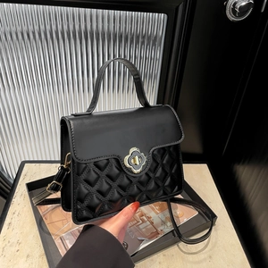 Fashionable black quilted leather handbag with gold clover lock for women commute
