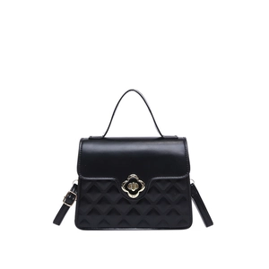 Fashionable black quilted handbag with metal floral twist lock and detachable strap