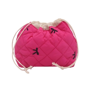 Quilted rose red drawstring pouch with black bow embroidery and secure cotton rope closure