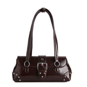 Retro dark brown patent leather shoulder bag with silver buckle and rivets on white background