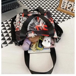 Close-up of graffiti canvas tote interior showing spacious capacity for daily essentials