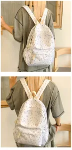 Detail view of stars printed school backpack with padded straps for high school students