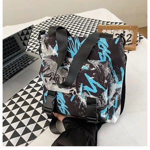 Detailed view of the street-style graffiti oxford bag showing durable plastic buckle