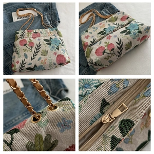 Detailed views of floral embroidery, golden chain strap, and smooth zipper closure