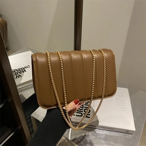 Brown vertical quilted chain shoulder bag with gold hardware for women, luxury handbag style