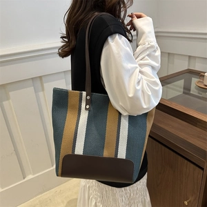 Fashionable striped canvas tote bag with leather straps and large capacity for women