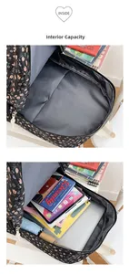 Internal large capacity of floral backpack showing storage for laptop and books