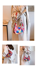 Detail shot of a colorful geometric pattern patchwork hobo bag with zip closure