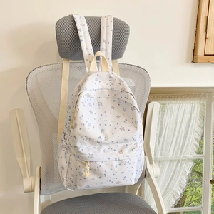 White canvas school backpack with blue and purple star print and large capacity