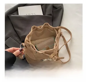 Detail view of large interior capacity for rice-coffee drawstring bucket bag with wallet
