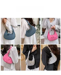Three crescent shoulder bags in denim blue print, metallic pink and silver wrinkled faux leather