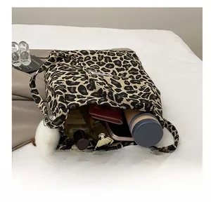 Interior view of leopard print canvas tote bag showing large capacity for essentials