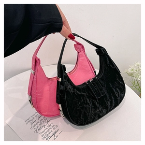 Minimalist crescent underarm bags in black and pink with pleated glossy leather texture