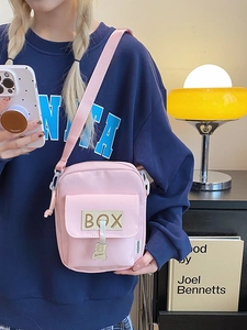 Pink canvas crossbody bag with cute bear pendant and adjustable strap for women