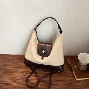 Minimalist canvas and leather tote bag with round metal buckle for casual commuting