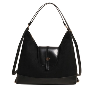 Large black textured tote bag with mixed suede and leather materials for casual commute