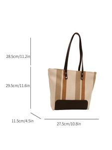 Detailed size chart of the striped canvas tote bag with dimensions in cm and inches