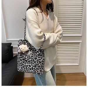 Detail view of the large capacity canvas tote bag with black and white leopard print